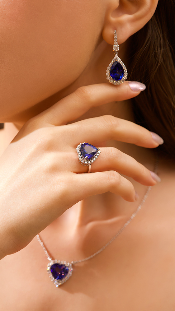 Luxury sapphire diamond jewellery set featuring ring earrings and pendant necklace elegant gemstone jewellery photography